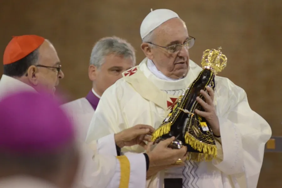 Pope Francis holds a statue of the Virgin Mary at the National Shrine of Our Lady of Aparecida July 24. ?w=200&h=150