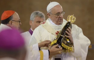 Pope Francis holds a statue of the Virgin Mary at the National Shrine of Our Lady of Aparecida July 24.   Ronaldo Correa via JMJ Rio 2013/Flickr (CC BY-NC-SA 2.0)