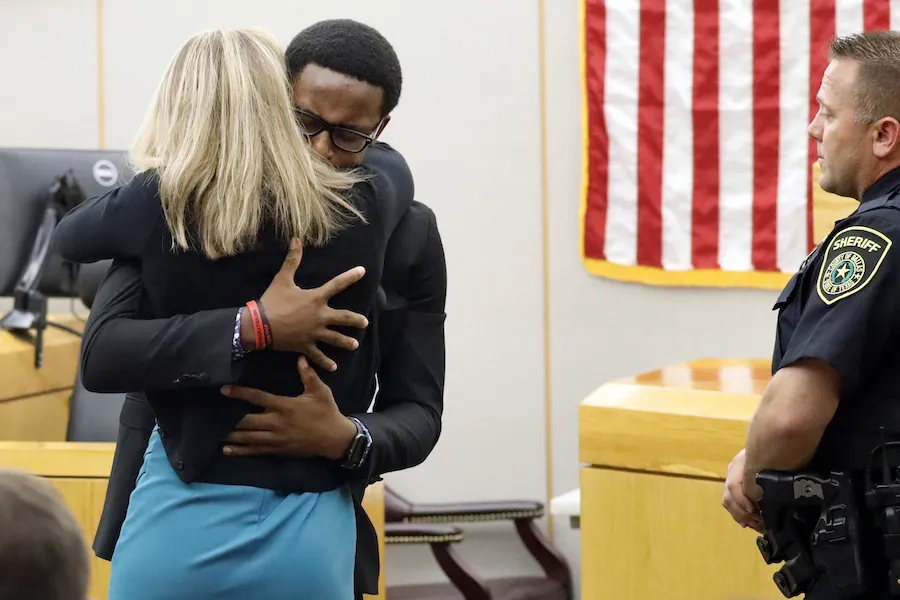 Brandt Jean hugs former Dallas police officer Amber Guyger as she is sentenced for the murder of his brother Botham Jean. Photo: Tom Fox/Dallas Morning News via AP, Pool. Not licensed for reproduction?w=200&h=150