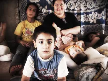 A Christian refugee family of eight living in a construction site in Erbil, Iraq. Courtesy of International Christian Concern.
