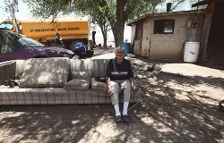 A Navejo elder sits in her yard while water is delivered to her home in Smith Lake, NM. ?w=200&h=150