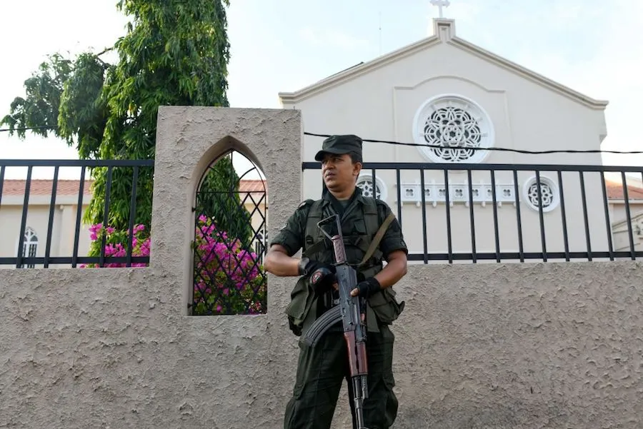 A Sri Lankan soldier stands guard outside St. Theresa’s church in Colombo on May 12, 2019. ?w=200&h=150