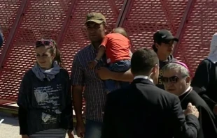 A Sryian refugee family prepares to board the papal plane from Lesbos to Rome with Pope Francis April 16, 2016.   Marco Mancini/CNA.
