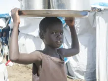 A child carrying water at the Tomping civilian protection site on May 6, 2014. 