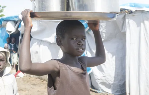 A child carrying water at the Tomping civilian protection site in Juba, South Sudan, May 6, 2014. ?w=200&h=150