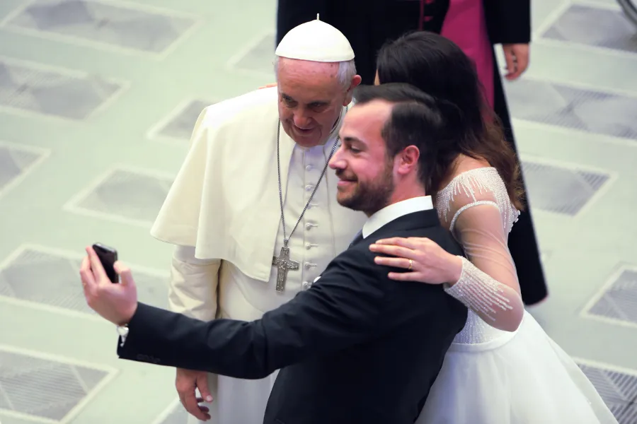 A couple snaps a selfie with Pope Francis at his Wednesday general audience on Feb. 4, 2015. ?w=200&h=150