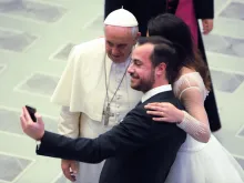 A couple snaps a selfie with Pope Francis at his Wednesday general audience on Feb. 4, 2015. 