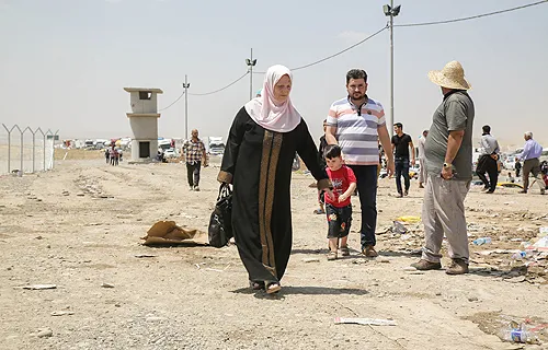 A family at the Khazair checkpoint after fleeing Mosul. ?w=200&h=150