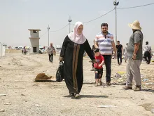 A family at the Khazair checkpoint after fleeing Mosul. 