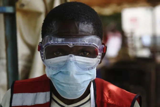 A health worker wears protective gear at a health screening facility in a Ugandan town bordering DRC Credit Isaac Kasamani  AFP  Getty Images