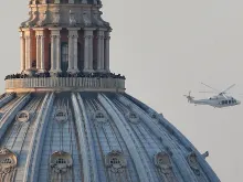 A helicopter carries Pope Emeritus Benedict XVI as he officially retires in Vatican City on February 28, 2013. 