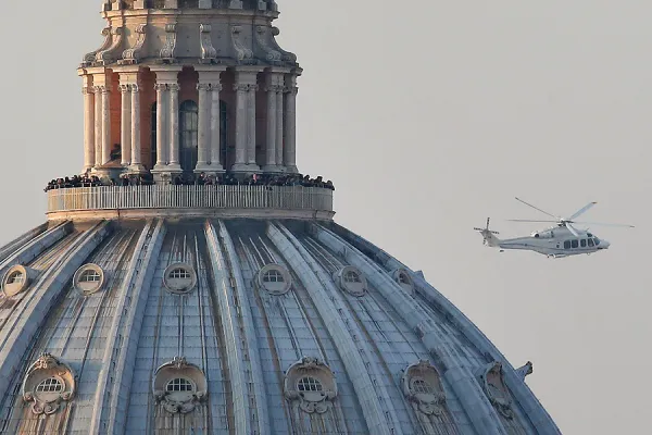 A helicopter carries Pope Emeritus Benedict XVI as he officially retires in Vatican City on February 28, 2013. . Getty Images News/Getty Images.