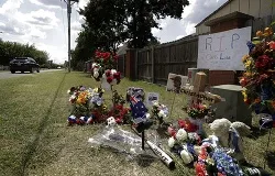 A makeshift memorial for slain Australian college student Christopher Lane outside the neighborhood where he was killed. ?w=200&h=150