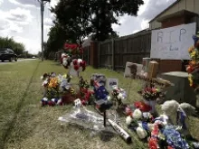 A makeshift memorial for slain Australian college student Christopher Lane outside the neighborhood where he was killed. 
