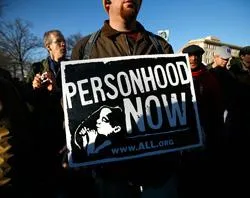 A man carries a pro-life sign at the annual 'March for Life' event in Washington, D.C. ?w=200&h=150