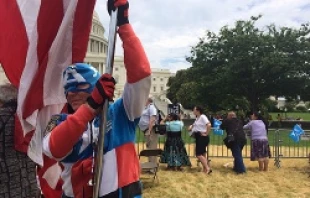 A man dressed as Captain America and holding an American flag takes part in the March for Marriage in Washington, D.C., June 19, 2014.   Addie Mena/CNA.