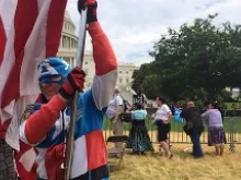 A man dressed as Captain America and holding an American flag takes part in the March for Marriage in Washington, D.C., June 19, 2014. 