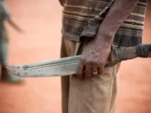 A man holds a machete (aka Balaka in Songo) on Nov. 8, 2013 in the outskirts of Bangui, Central African Republic. 