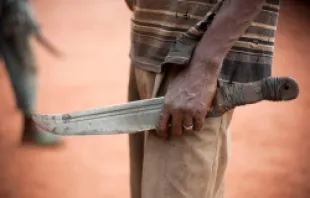 A man holds a machete (aka Balaka in Songo) on Nov. 8, 2013 in the outskirts of Bangui, Central African Republic.   MATTHIEU ALEXANDRE for Caritas International.