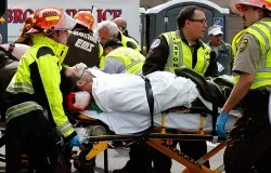 A man is loaded into an ambulance after he was injured by one of two bombs exploded during the 117th Boston Marathon near Copley Square on April 15, 2013. ?w=200&h=150