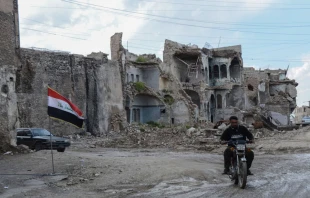 A man rides a motorcycle in the old city of Mosul, northern Iraq on April 21, 2019.   Said Al-Obeidi / AFP / Getty Images.