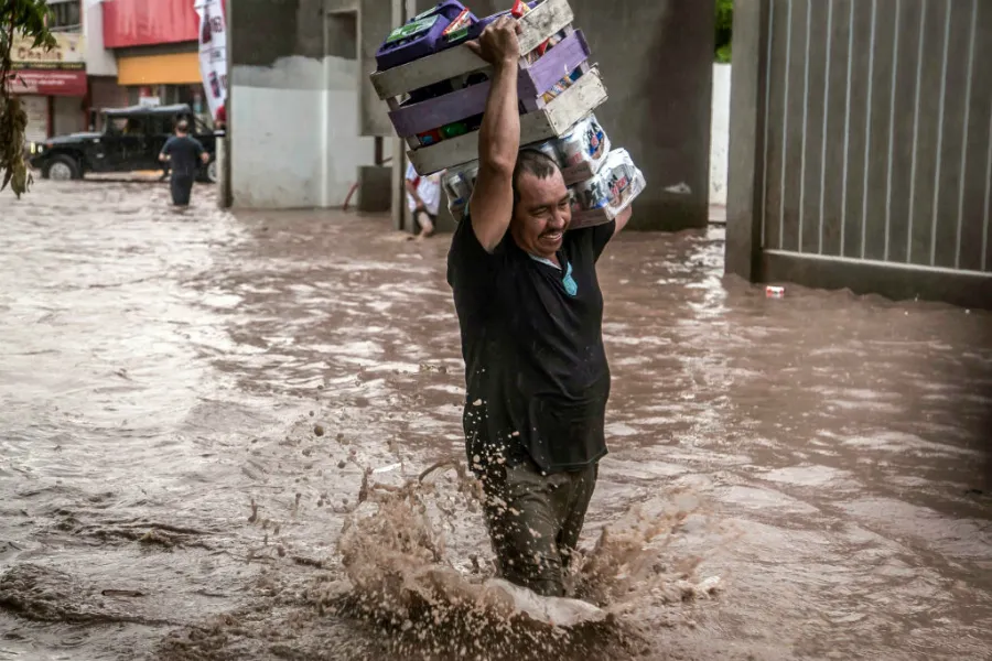 A man wades in a flooded street in Culiacan, Sinaloa State, Mexico, Sept. 20, 2018. ?w=200&h=150