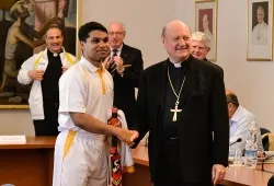 A member of St. Peter's Cricket Club greets Cardinal Gianfranco Ravasi during a June 23, 2014 press conference announcing their ?w=200&h=150