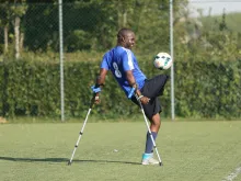 A member of Team Zaryen plays soccer. 