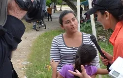 A mother holds her child after being deported from the United States back to Honduras. ?w=200&h=150