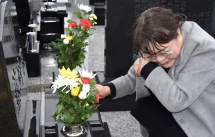 A mourner at a cemetery on the eighth anniversary of the March 11, 2011 tsunami in Japan.   Jiji Press / AFP / Getty Images. 