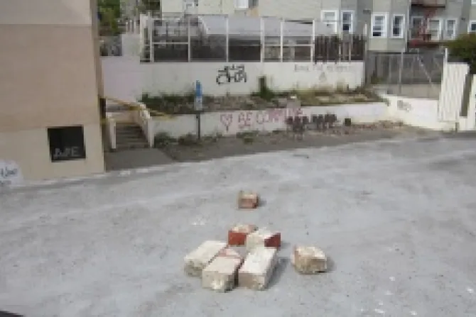 A pile of bricks on the roof of the building with graffitti defacing the walls of a courtyard in the background Credit SFPD CNA US Catholic News 4 3 12