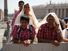 A family at the Pope's General Audience in St. Peter's Square, May 13, 2015. 