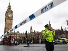 A police officer stands guard near Westminster Bridge and the Houses of Parliament on March 22, 2017 in London, England. 