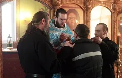 A prisoner receives Holy Communion at the Orthodox prison chapel in Nizhny Novgorod, Russia. ?w=200&h=150