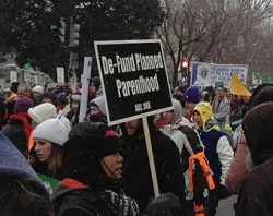 A pro-life supporter holds a Defund Planned Parenthood sign at the March for Life, Jan. 25, 2012. ?w=200&h=150