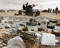 A rebel mans an anti-aircraft gun in Ras Lanuf March 8, 2011 / Photo ?w=200&h=150