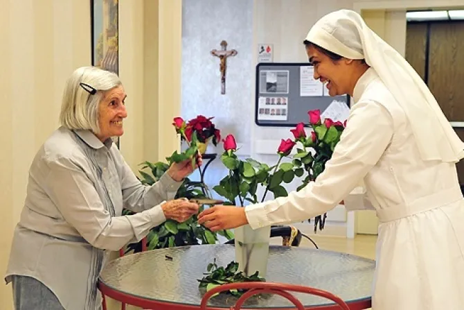 A resident and a sister arrange flowers at the Little Sisters of the Poors Mullen Home in Denver CO in this undated file photo Credit El Pueblo CatolicoJames Baca CNA