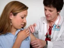 A student recieves a vaccination. 