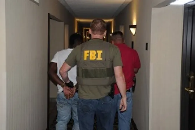 A suspect is taken into custody by FBI agents in Jackson Mississippi during Operation Cross Country VIII in June 2014 Credit Federal Bureau of Investigation CNA 6 26 14