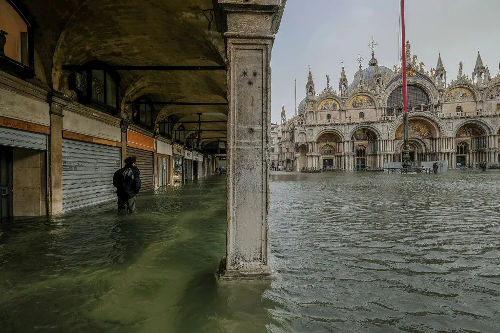 A tourist walks through the water in Piazza San Marco Oct. 29, 2018 in Venice, Italy. ?w=200&h=150