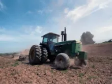 A tractor turns the cover crop into the soil in preparation for planting in the Salinas Valley of Calif. on June 16, 2011. 