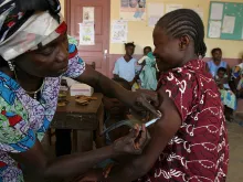 A woman receives a tetanus vaccine at the Pissa health centre in Central African Republic, January 2008. 
