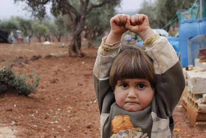 A young Syrian child raises her arms in a gesture of surrender Credit Osman Sagirli Courtesy of Turkiye CNA 4 1 15