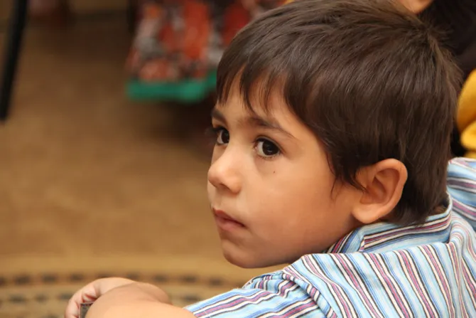 A young Syrian refugee at school in Ramtha Jordan on Oct 27 2014 Credit Kim Pozniak Catholic Relief Services 2 CNA 12 2 14