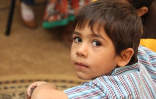 A young Syrian refugee at school in Ramtha, Jordan on Oct. 27, 2014.   Kim Pozniak/Catholic Relief Services.