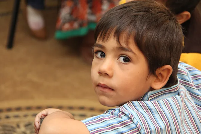 A young Syrian refugee at school in Ramtha Jordan on Oct 27 2014 Credit Kim Pozniak Catholic Relief Services CNA 12 2 14