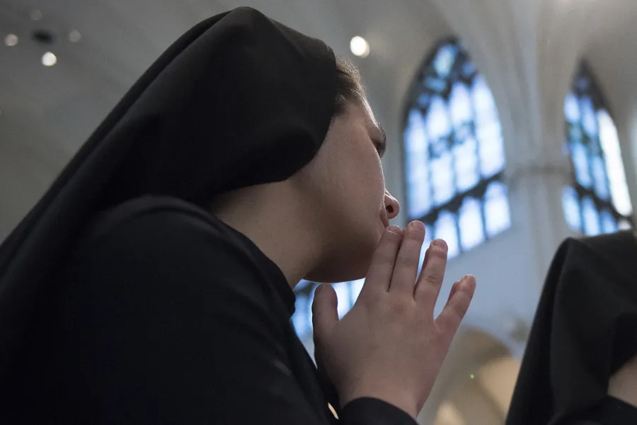 A young religious sister prays at the Cathedral of the Immaculate Conception in Denver, Jan. 17, 2105. ?w=200&h=150