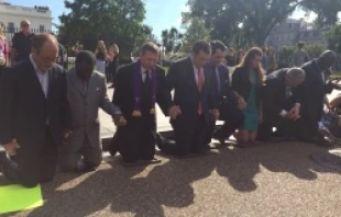 Participants kneel at a Sept. 26 prayer vigil for Pastor Saeed Abedini, held in Washington, D.C.   Addie Mena/CNA.
