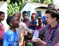 An aid worker administers medicine in Haiti?w=200&h=150
