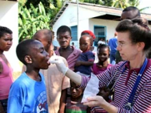 An aid worker administers medicine in Haiti